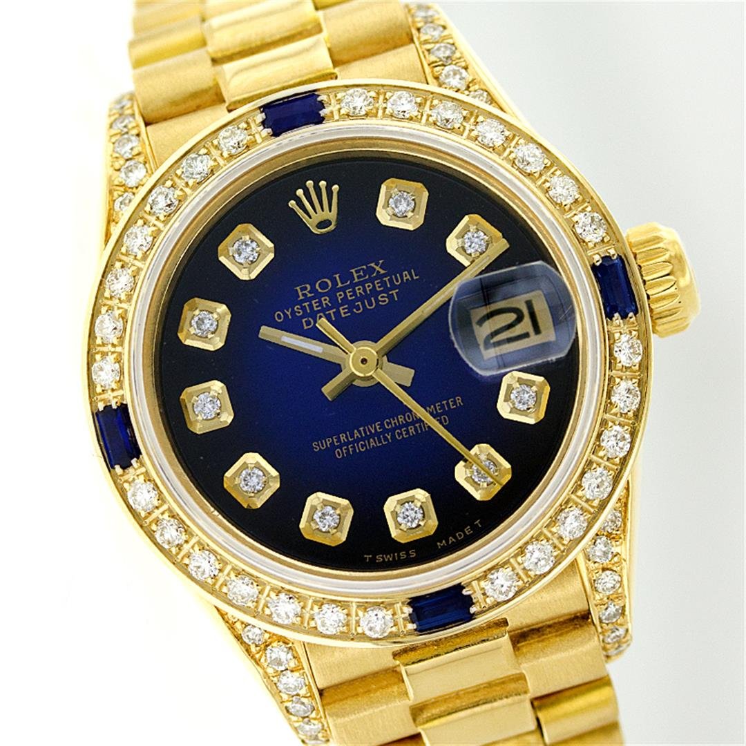 Rolex 18KT Gold Diamond and Sapphire President Ladies: One Ladies Rolex President Polished, Serviced & Electronically Tested, Yellow Gold Case With Diamond Lugs: 26mm G to H In Color, SI1, Yellow Gold Crown, Custom Bezel: 18K Yellow Gold Sapphire Beadset 