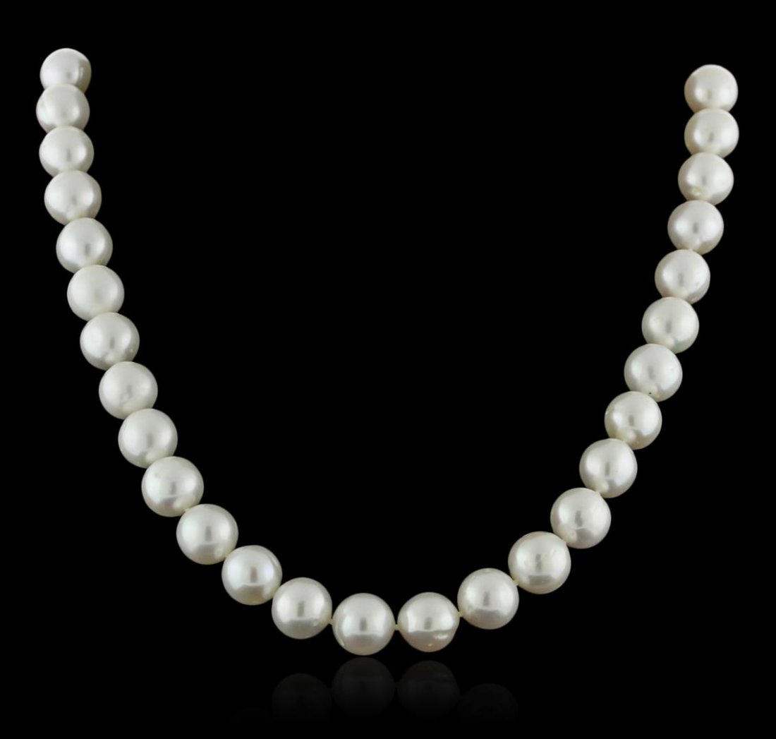 14KT White Gold Pearl Necklace: One necklace featuring: 14KT white gold weighing 67.74 grams containing 38 fresh water pearls measuring 11mm.