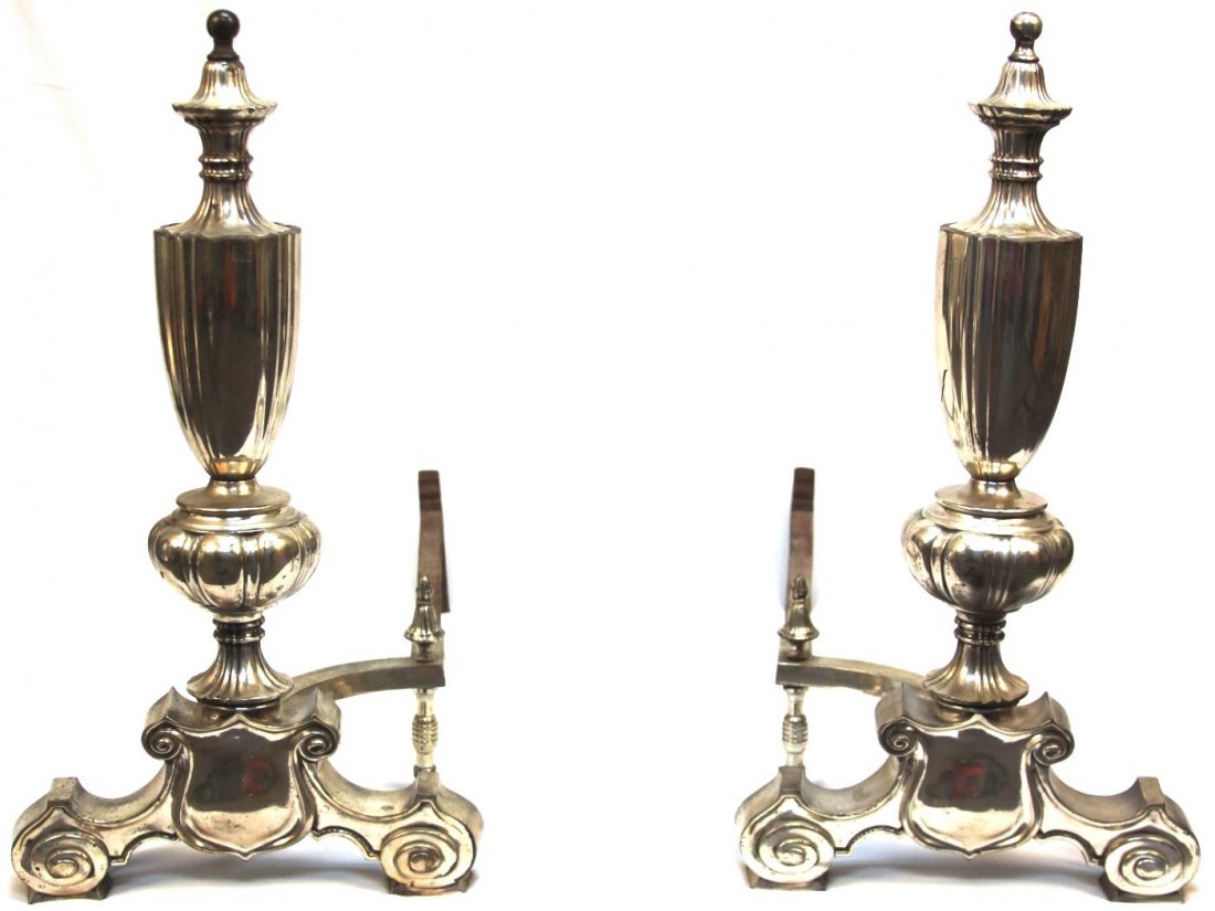 Pair of Modern Silvered Metal Andirons: One pair of Modern Silvered Metal Andirons, perfect for any fireplace in need of a little ornamentation. Each side measures approximately 31" long x 16" wide x 29.5" tall. ***THIS ITEM CANNOT SHIP INT