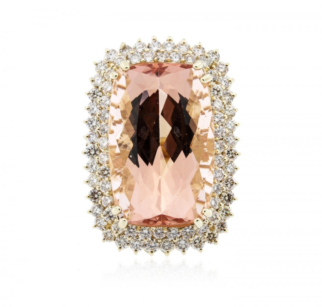 14KT Yellow Gold GIA Certified 38.31ct Morganite and: One electronically tested 14KT yellow gold ladies cast morganite and diamond ring with a bright polish finish. The featured morganite is set within two tiered diamond bezels, completed by a three mill