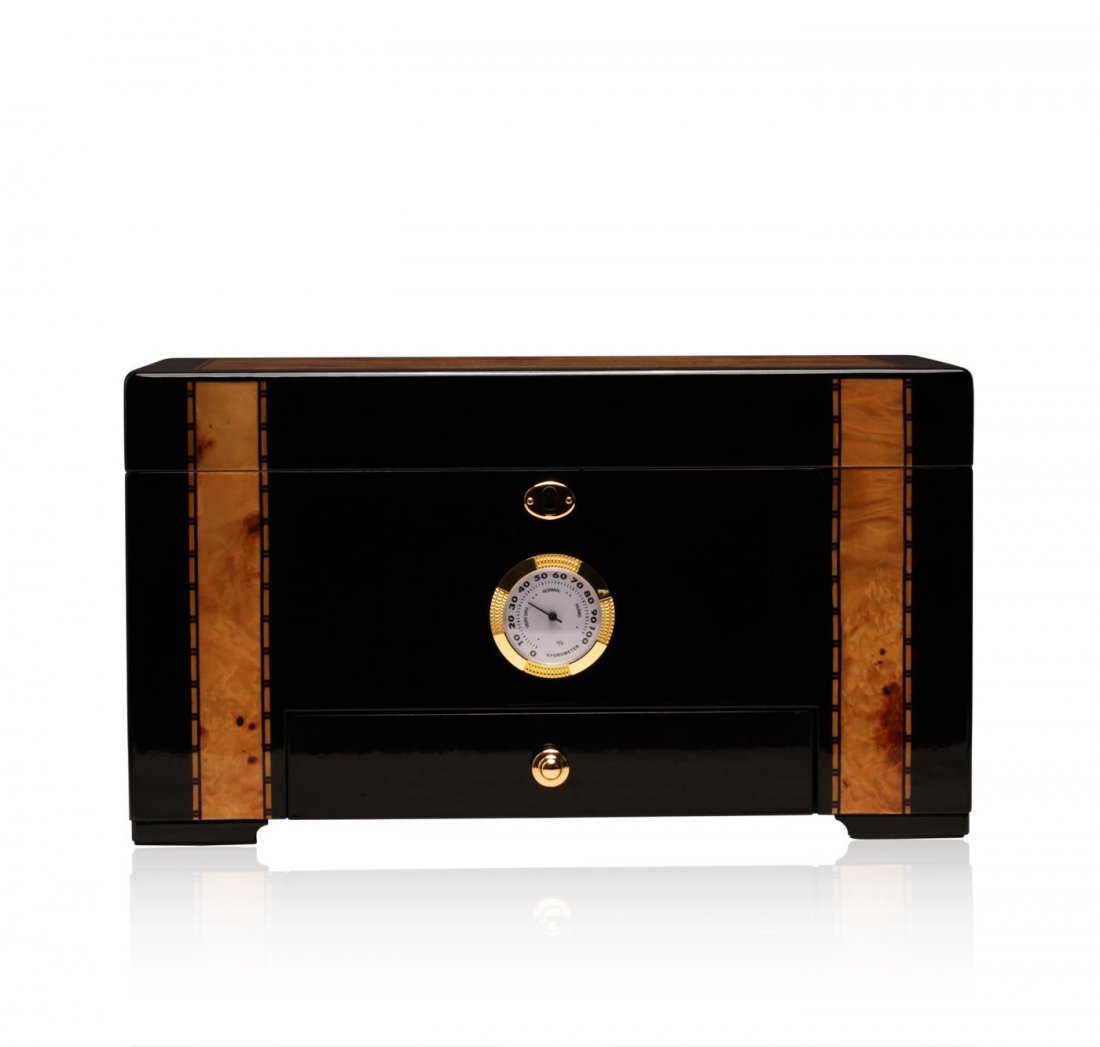 African Blackwood Deluxe Cigar Humidor: One deluxe cigar humidor featuring a glossy African blackwood with genuine birdseye maple inlay exterior lined with premium Spanish cedar and solid brass hardware including hidden quadrant piano hinge
