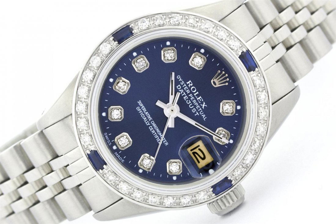 Rolex Stainless Steel Diamond and Sapphire DateJust: One Ladies Rolex Datejust Polished Bright with Satin Finish, Serviced & Electronically Tested, Stainless Steel Case:26mm, Stainless Steel Crown, Custom Bezel: 18K White Gold Sapphire Beadset Diamond B