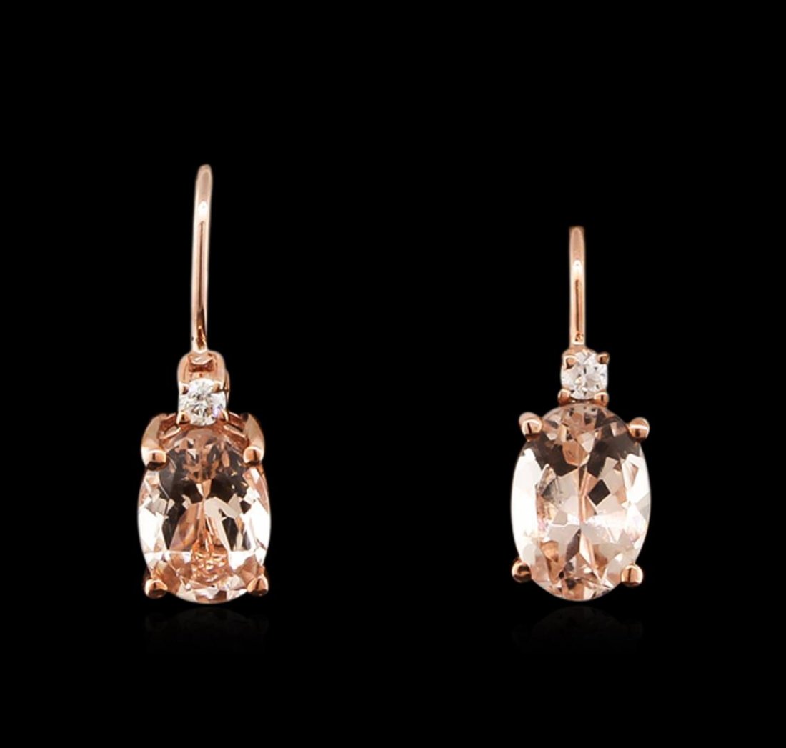 14KT Rose Gold 1.44ctw Morganite and Diamond Earrings: One pair of earrings featuring: 14KT rose gold weighing 1.35 grams containing two morganites with a total weight of 1.44ct and two round diamonds with a total weight of 0.04ct.