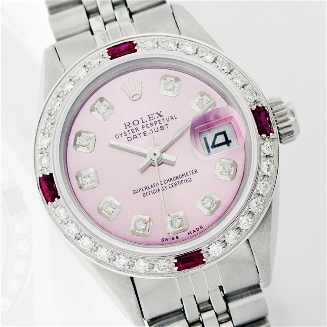Rolex Stainless Steel Diamond And Ruby DateJust Ladies: One Ladies Rolex Datejust Polished Bright with Satin Finish, Serviced & Electronically Tested, Stainless Steel Case:26mm, Stainless Steel Crown, Custom Bezel: 18K White Gold Ruby Beadset Diamond Bezel
