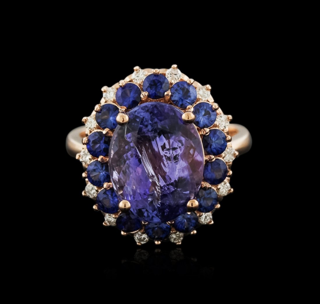 14KT Rose Gold 5.94ct Tanzanite, Sapphire and Diamond: One electronically tested 14KT rose gold ladies cast tanzinite, sapphire and diamond ring with a bright polish finish. Identified with markings of "14K". Condition is new. Containing: One prong set ov