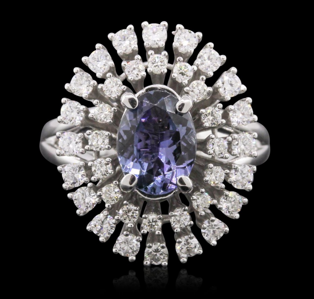 14KT White Gold 1.78ct Tanzanite and Diamond Ring: One electronically tested 14KT white gold Ladies combination cast & assembled ring with a bright polish finish. Condition is new. Identified with markings of "14K". Containing: One prong set oval modi