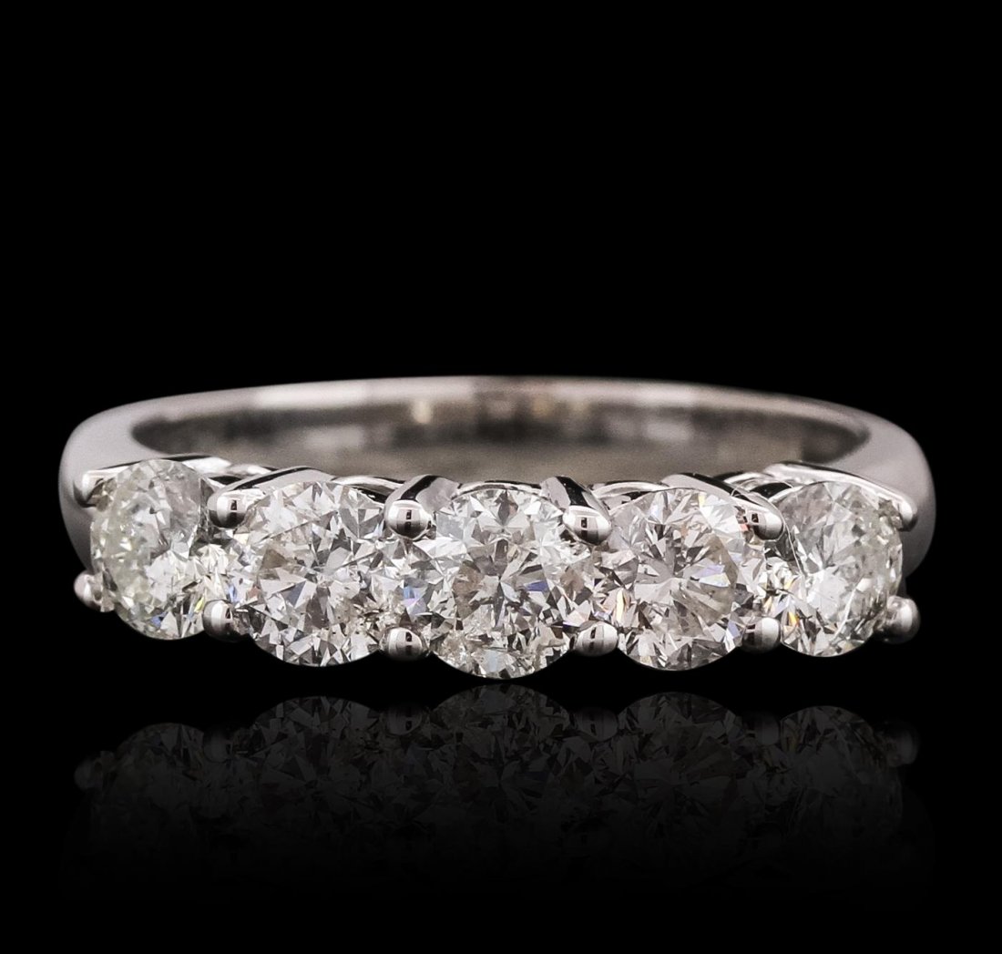 14KT White Gold 1.17ctw Diamond Ring: One electronically tested 14KT white gold ladies cast anniversary ring with a bright polish finish. Identified with markings of "14K". Condition is new. Containing: Five prong set round brilliant cut 