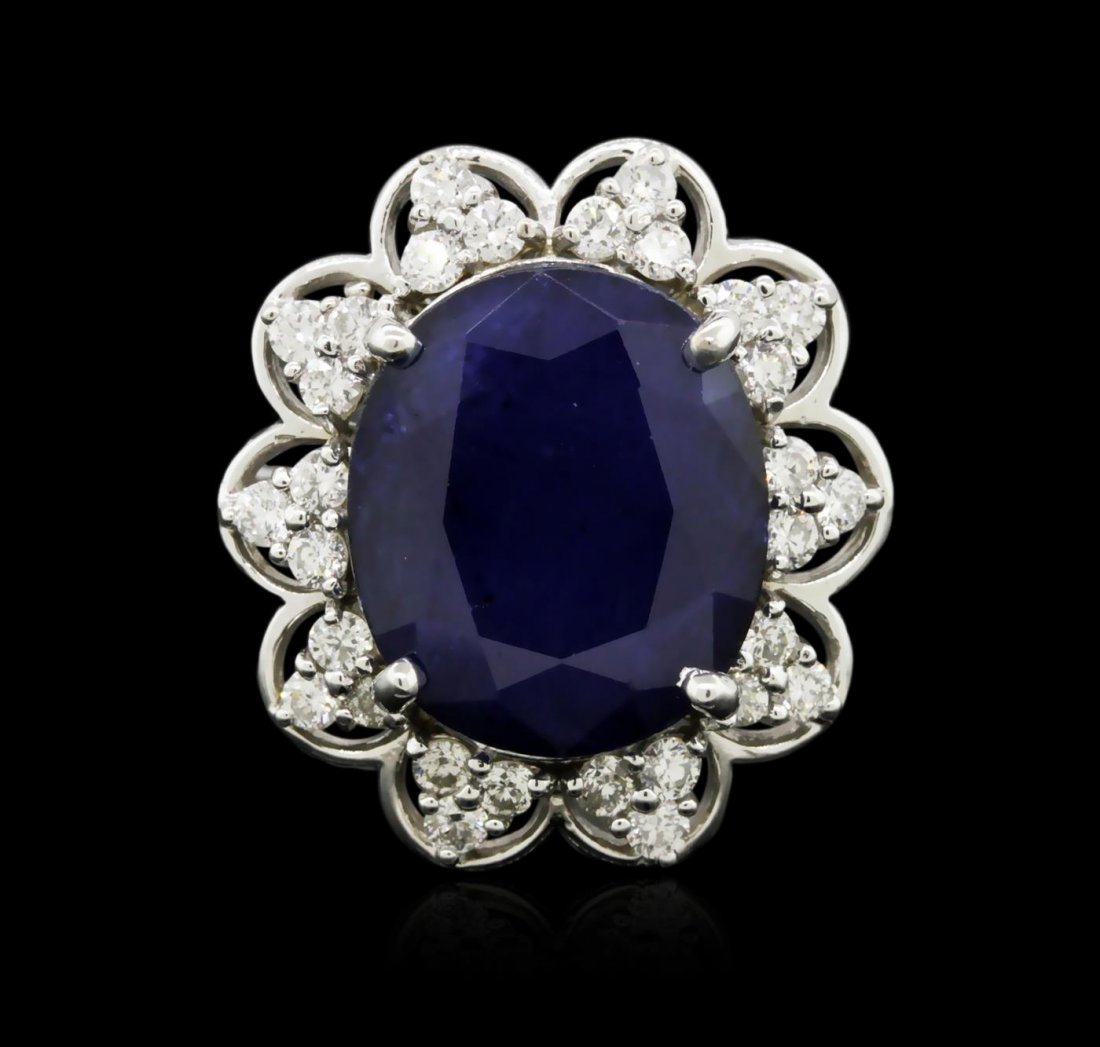 14KT White Gold 10.12ct Sapphire and Diamond Ring: One electronically tested 14KT white gold ladies cast sapphire and diamond ring with a bright polish finish. Identified with markings of "14K". Condition is new. Containing: One prong set oval modifie