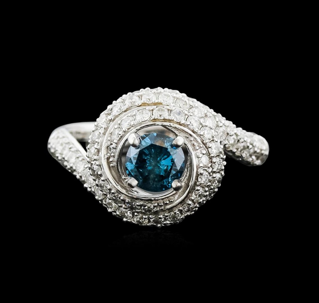 14KT White Gold 1.29ctw Fancy Blue Diamond Ring: One electronically tested 14KT white gold ladies cast diamond engagement ring with a bright polish finish. Identified with markings of "14K". Condition is new. Containing: One prong set round brillian