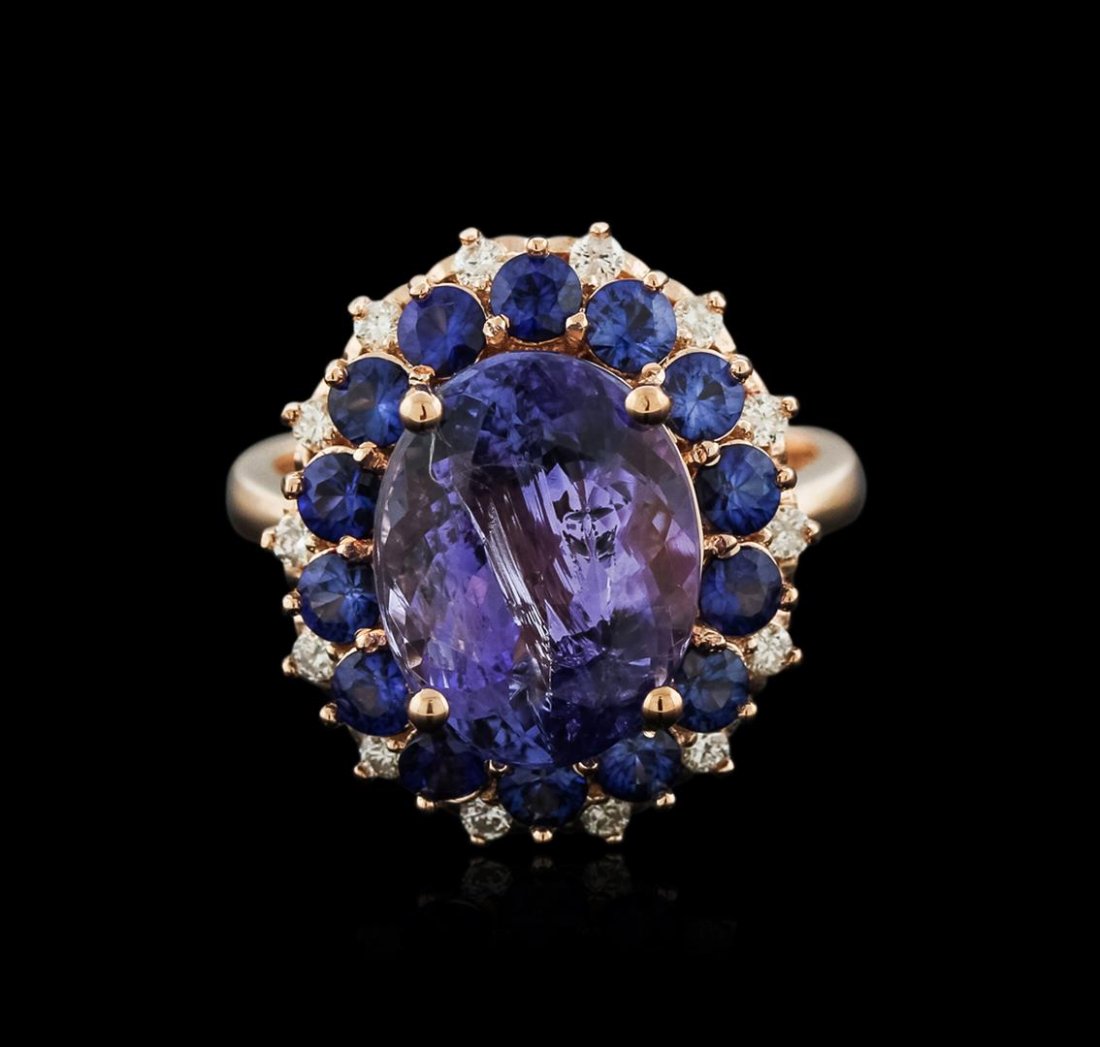 14KT Rose Gold 5.94ct Tanzanite, Sapphire and Diamond: One electronically tested 14KT rose gold ladies cast tanzinite, sapphire and diamond ring with a bright polish finish. Identified with markings of "14K". Condition is new. Containing: One prong set ov