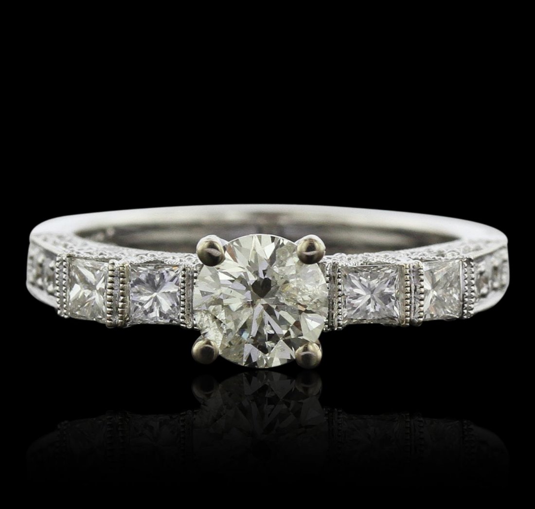 18KT White Gold 1.69ctw Diamond Ring: One electronically tested 18KT white gold ladies cast diamond ring with a bright and milgrain finish. Condition is new, good workmanship. The featured diamond is supported by diamond set shoulders and