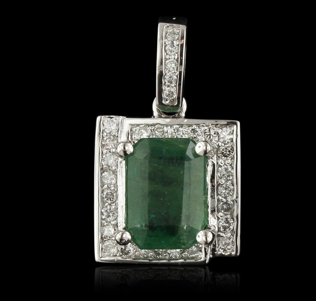14KT White Gold 3.06ct Emerald and Diamond Pendant: One electronically tested 14KT white gold ladies cast & assembled emerald and diamond pendant with a bright polish finish. Condition is new, good workmanship. The featured emerald is set within a styl