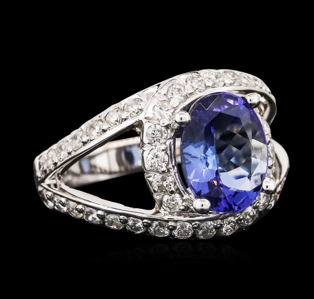 14KT White Gold 2.37ct Tanzanite and Diamond Ring: One electronically tested 14KT white gold ladies cast tanzanite and diamond ring with a bright polish finish. Identified with markings of "14K". Condition is new. Containing: One prong set oval modifi