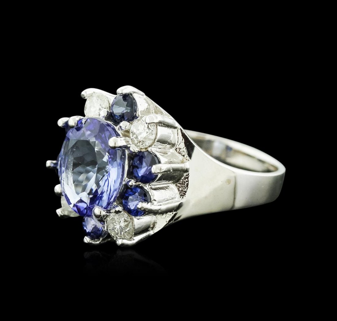 14KT White Gold 2.52ct Tanzanite, Sapphire and Diamond: One electronically tested 14KT white gold ladies cast tanzanite, sapphire and diamond ring with a bright polish finish. Identified with markings of "K14". Condition is new. Containing: One prong set o