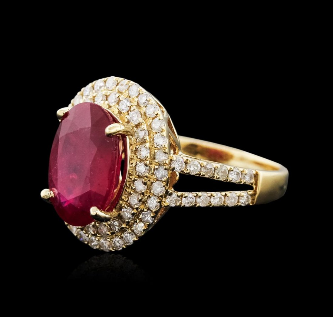 14KT Yellow Gold 4.25ct Ruby and Diamond Ring: One electronically tested 14KT yellow gold ladies cast ruby and diamond ring with a bright polish finish. Identified with markings of "14K". Condition is new. Containing: One prong set oval modified b