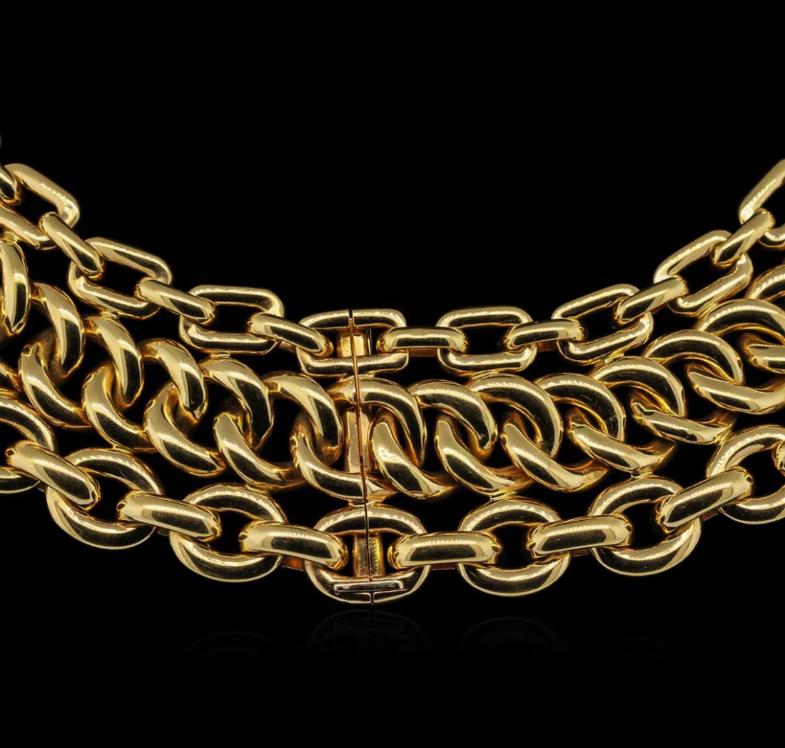 Ralph Lauren 18KT Yellow Gold Necklace: One electronically tested 18KT yellow gold ladies cast & assembled necklace with a bright polish finish. Fifteen and one-half inch length necklace features a hone and one-half wide ribbon consisting o