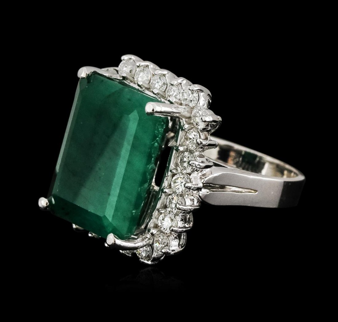 14KT White Gold 10.52ct Emerald and Diamond Ring: One electronically tested 14KT white gold ladies cast emerald and diamond ring with a bright polish finish. Identified with markings of "14K". Condition is new. Containing: One prong set emerald modif