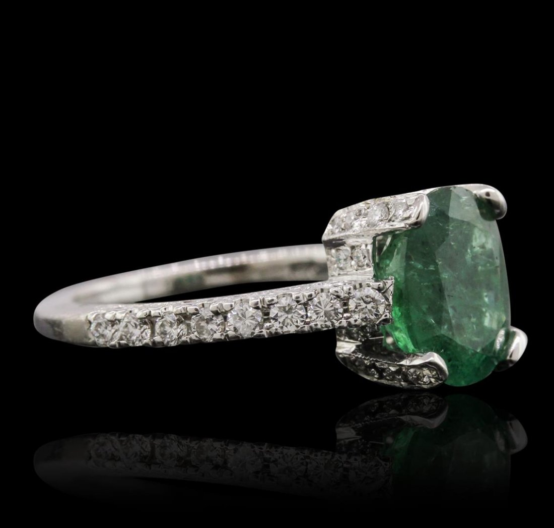 14KT White Gold 2.32ct Emerald and Diamond Ring: One electronically tested 14KT white gold Ladies combination cast & assembled ring with a bright polish finish. Condition is new. Identified with markings of "14K". Containing: One prong set oval modi
