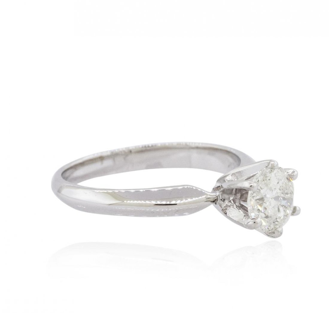 14KT White Gold 1.00ct Brilliant Cut Diamond Solitaire: One electronically tested 14KT white gold ladies cast diamond solitaire ring with a bright polish finish. The ring is completed by a two millimeter wide band. Identified with markings of "14K". Condit