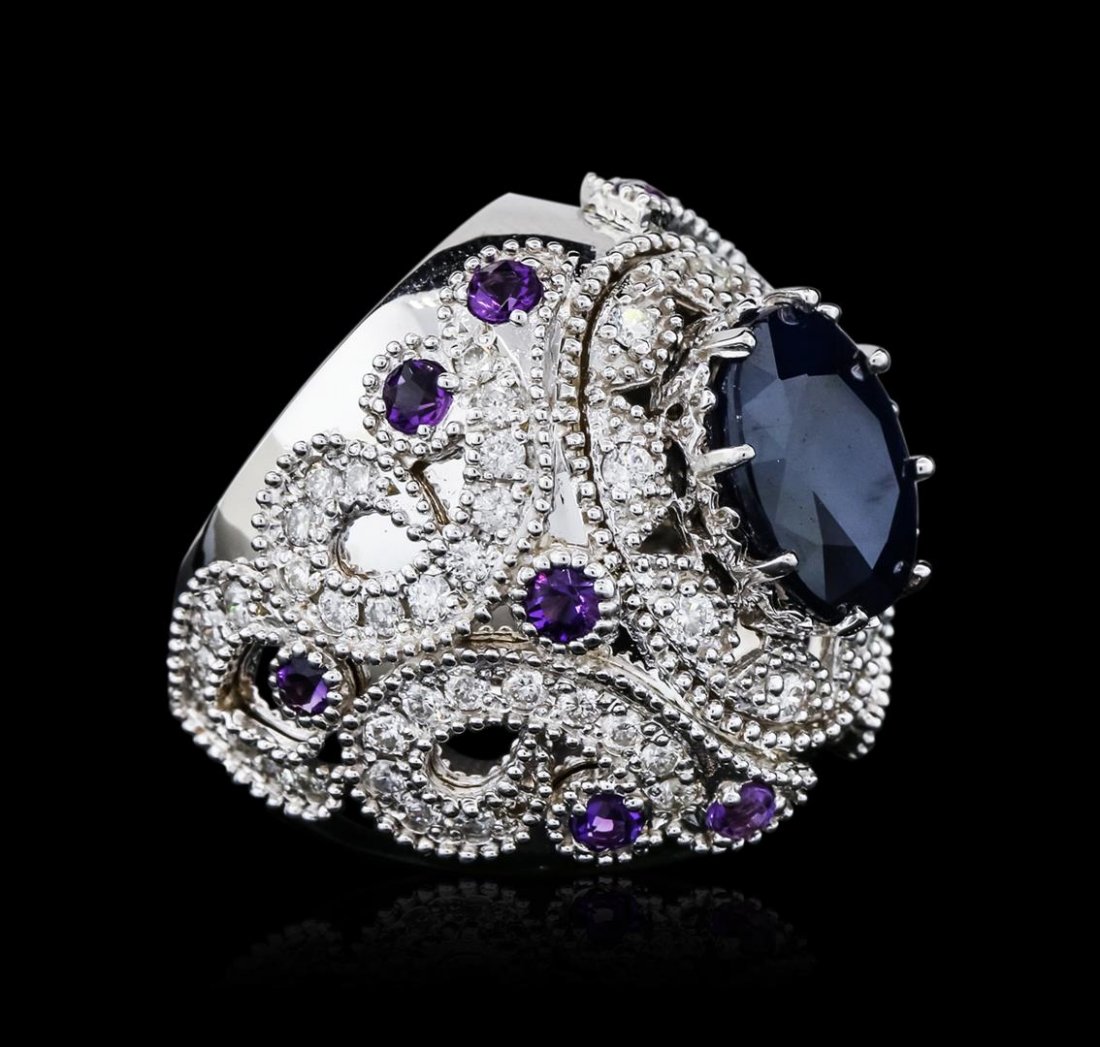 14KT White Gold 9.01ctw Sapphire and Diamond Ring: One electronically tested 14KT white gold ladies combination cast & assembled sapphire, amethyst and diamond ring with a bright polish finish. Condition is new. Containing: One prong set oval modified