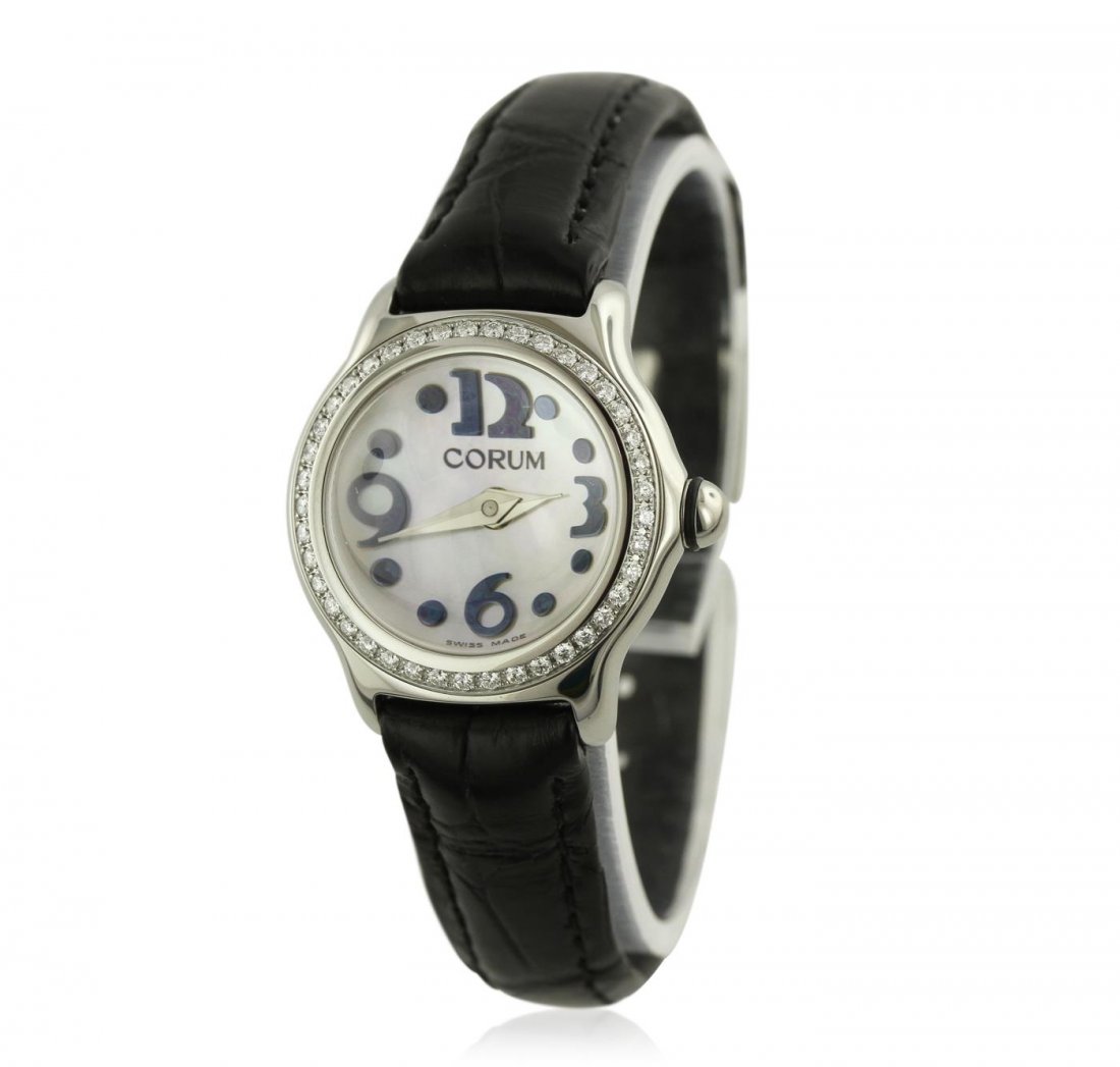 Corum Stainless Steel Diamond Ladies Watch: One ladies Corum Bubble wristwatch featuring: Black Leather Strap with black stitching, Diamond Bezel, Stainless Steel Case, Lugs, Crown, and Bezel, Analog Display with Magnified White Dial, Black Ara
