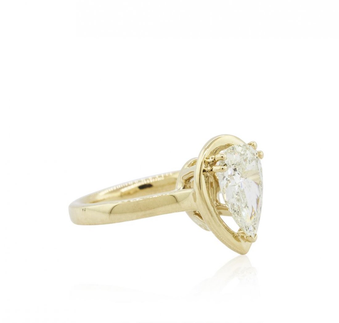 14KT Yellow Gold 1.71ct Pear Cut Diamond Solitaire Ring: One electronically tested 14KT yellow gold ladies cast diamond solitaire ring with a bright polish finish. The ring is completed by a two and one-half millimeter wide band. Identified with markings of