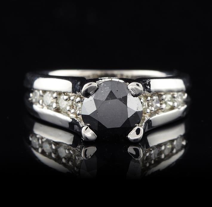 14KT White Gold 1.65ct Black & White Diamond Ring: One electronically tested 14KT white gold ladies cast cathedral style diamond unity ring with a bright polish finish. Condition is new, good workmanship. The featured black diamond is prong set in a c