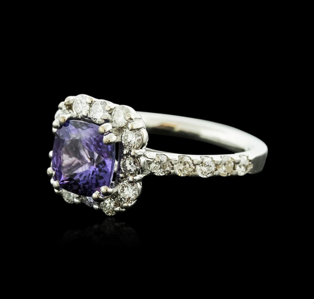 14KT White Gold 2.53ct Tanzanite and Diamond Ring: One electronically tested 14KT white gold ladies cast tanzanite and diamond ring with a bright polish finish. Identified with markings of "14K". Condition is new. Containing: One prong set square cush