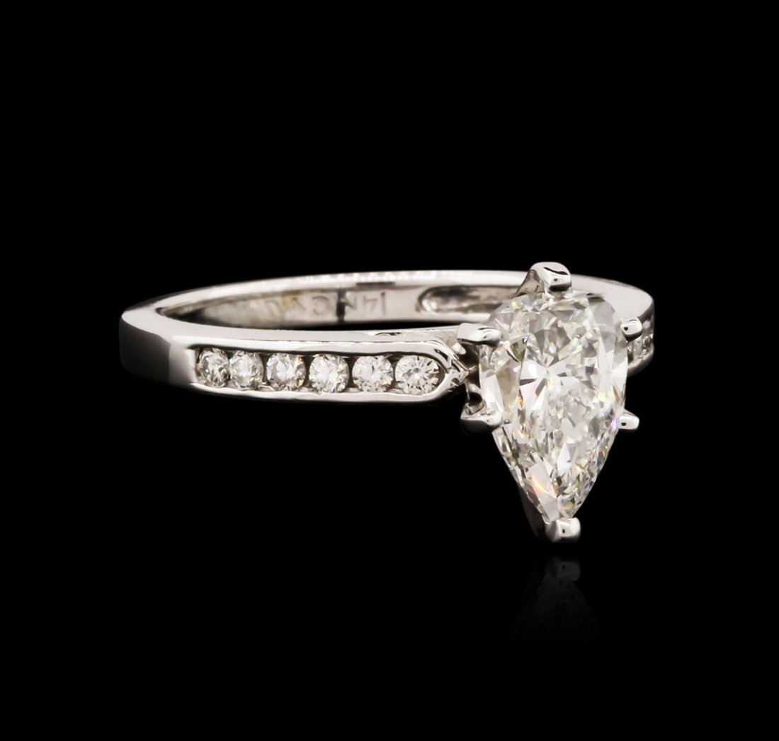 14KT White Gold 1.44ctw Diamond Ring: One electronically tested 14KT white gold ladies cast diamond engagement ring with a bright polish finish. Identified with markings of "14KT". Condition is new. Containing: One prong set pear shaped c