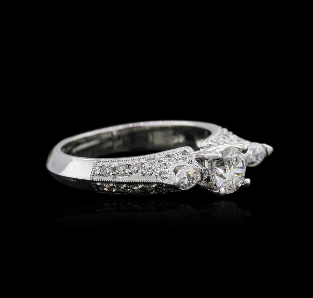 18KT White Gold 1.04ctw Diamond Ring: One electronically tested 18KT white gold ladies cast diamond engagement ring with a bright polish finish. Identified with markings of "18K". Condition is new. Containing: One prong set round brillian