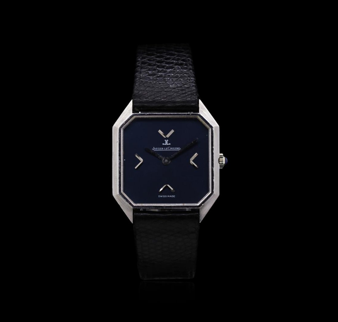 Jaeger LeCoultre Stainless Steel Watch: Swiss made. Case: Stainless steel. Dial: Dark blue/purple color; silver tone hands; signed Jaeger LeCoultre. Band: Black alligator leather.