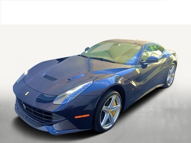 2014 Ferrari F12 Berlinetta: This stunning color combination in the classic Ferrari color of Pozzi Blu with Iroko interior. Extremely well maintained with 1442 miles. The classic combination is elegant and sporty, with the powe