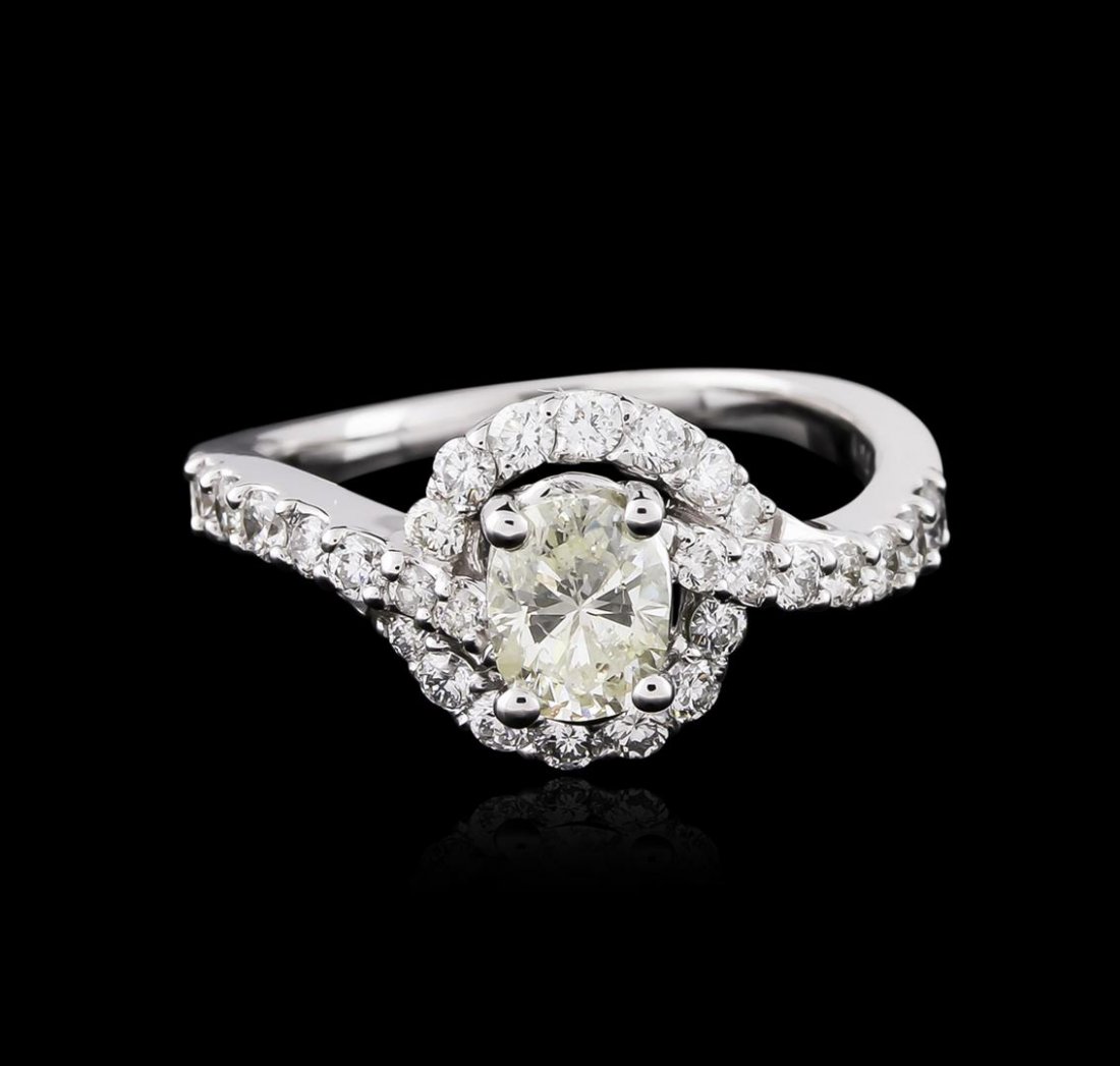 14KT White Gold 1.24ctw Diamond Ring: One electronically tested 14KT white gold ladies cast diamond engagement ring with a bright polish finish. Identified with markings of "14K". Condition is new. Containing: One prong set oval shaped cu