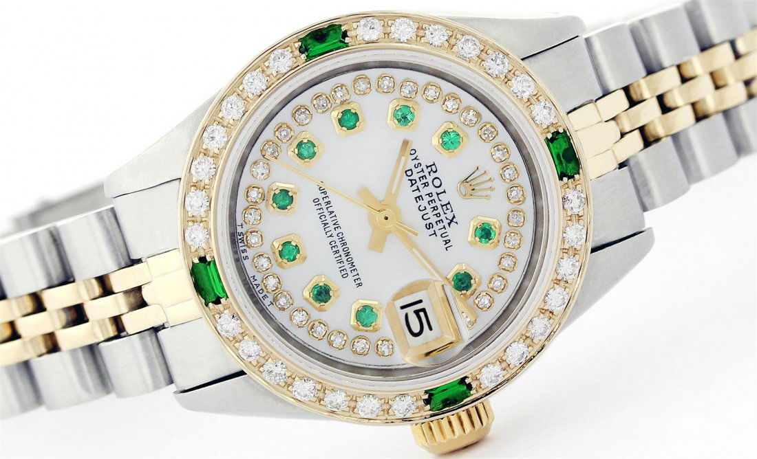 Rolex Two-Tone Diamond and Emerald DateJust Ladies: One Ladies Two Tone Rolex Datejust Polished, Serviced & Electronically Tested, 14K Yellow Gold & Stainless Steel Case:26mm, 14K Yellow Gold Crown, Custom Bezel: 18K Yellow Gold Emerald Beadset Diamond