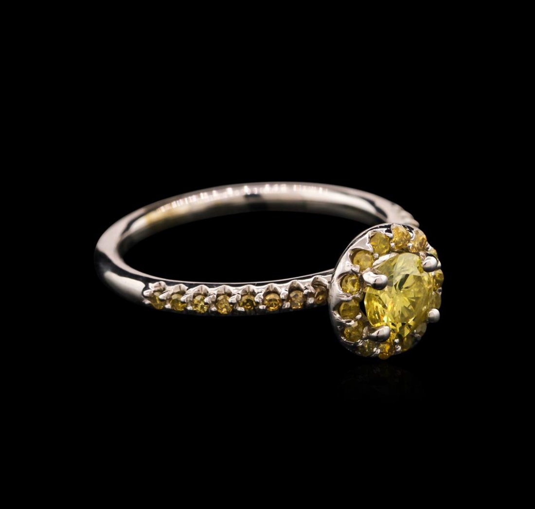 0.92ctw Yellow Diamond Ring - 14KT White Gold: One ring featuring: 14KT white gold weighing 2.78 grams containing one yellow diamond center stone with a total weight of 0.63ct and 30 yellow side diamonds with a total weight of 0.29ct.