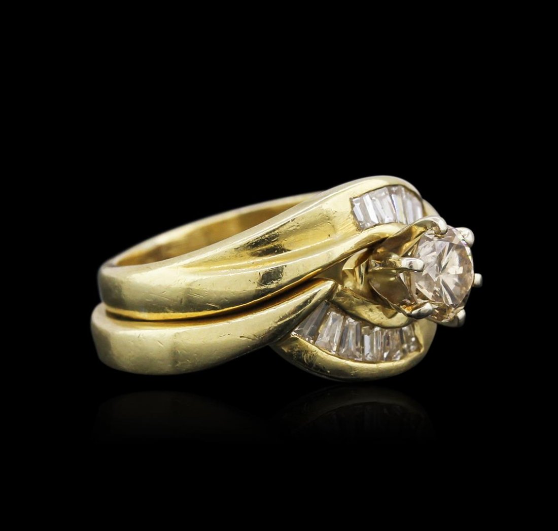 14KT Yellow Gold 0.95ctw Diamond Wedding Ring Set: One set electronically tested 14KT yellow gold ladies cast diamond engagement ring & wedding band with a bright polish finish. Identified with markings of "14KP". Condition is very good. Containing: O