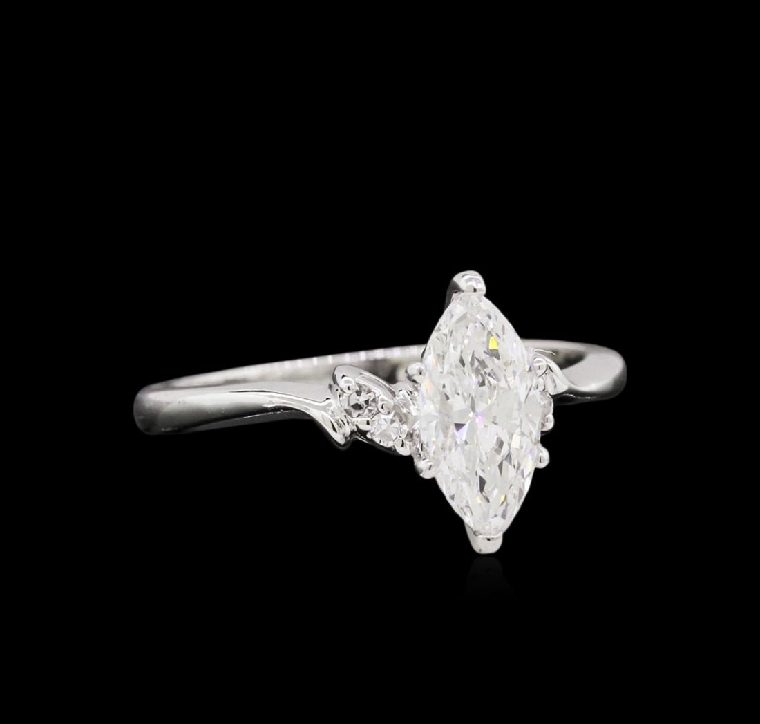 1.05ctw Diamond Ring - 14KT White Gold: One electronically tested 14KT white gold lady's cast wedding ring with a bypass shank with a bright polish finish. The featured lady's ring has a shank measuring 1.71 millimeters wide. Condition is n
