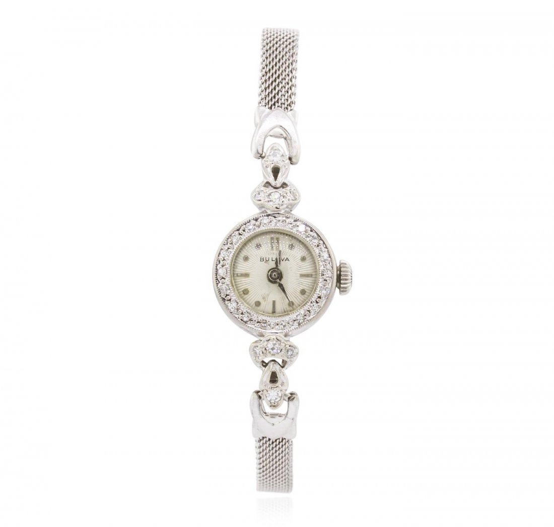 Bulova 14KT and 10KT White Gold 0.22ctw Diamond Ladies: One ladies, vintage Bulova diamond wristwatch electronically tested, 14KT white gold Case: 15mm diameter, Scalloped Crown: dial & movement set, Bezel: diamond, Crystal: domed acrylic. Case No. 59875.S