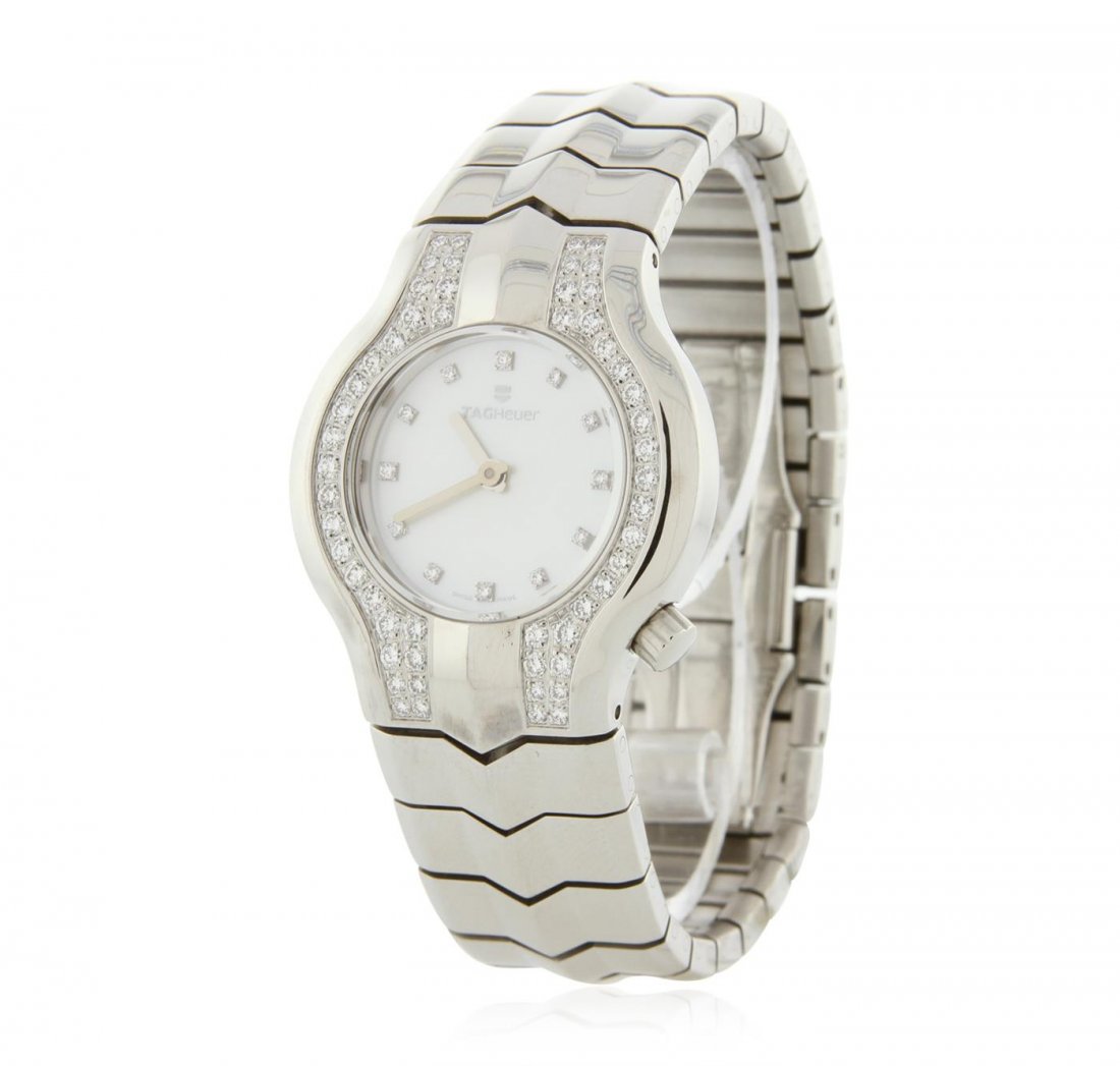 Tag Heuer Stainless Steel Diamond Ladies Watch: One Ladies Tag Heuer Stainless Steel Diamond Wristwatch featuring: Stainless Steel Case, Crown, Lugs and Bracelet, Diamond Bezel, White Dial with analog display, hour and second hands, diamond hour ma
