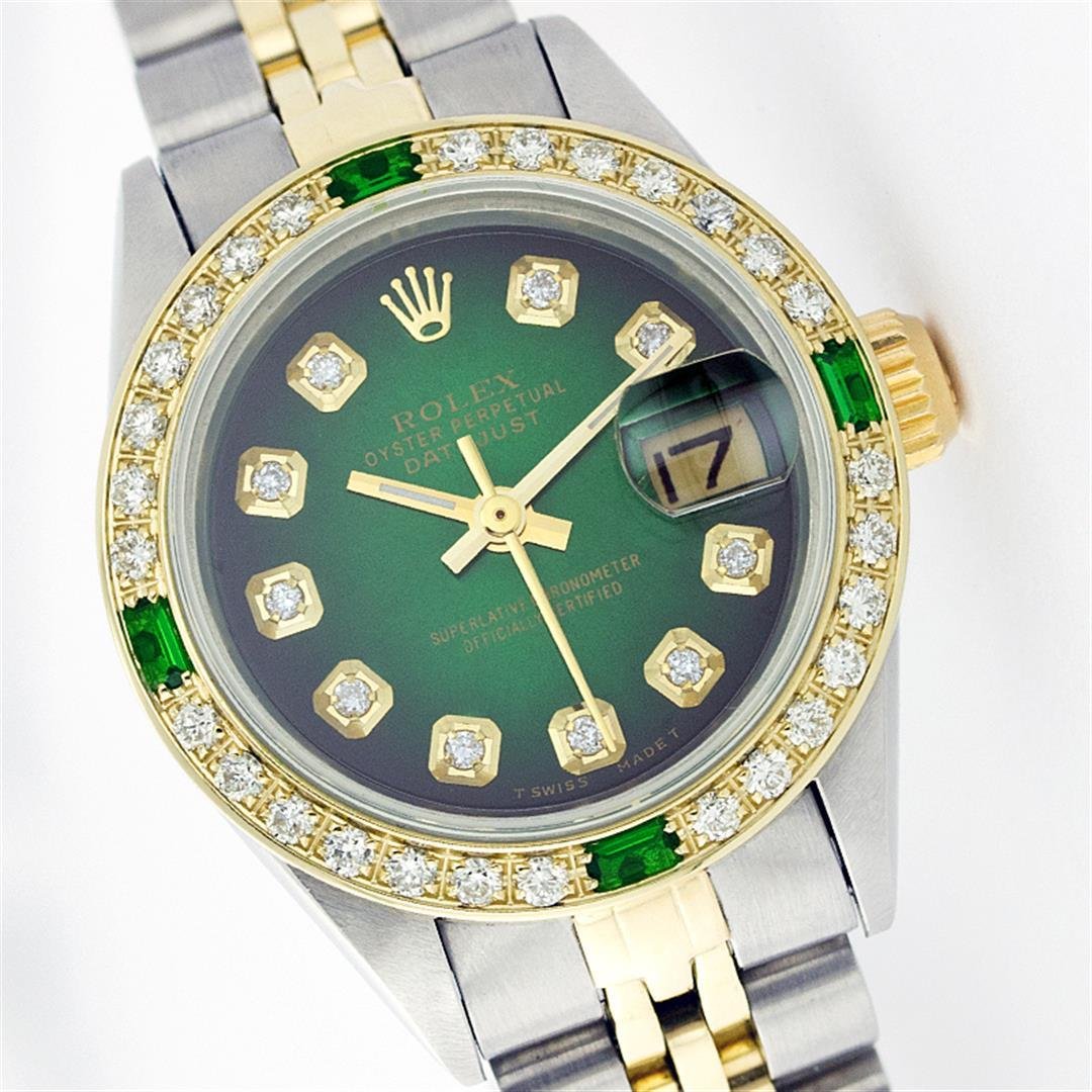 Rolex Two-Tone Diamond and Emerald DateJust Ladies: One Ladies Two Tone Rolex Datejust Polished, Serviced & Electronically Tested, 14K Yellow Gold & Stainless Steel Case:26mm, 14K Yellow Gold Crown, Custom Bezel: 18K Yellow Gold Emerald Beadset Diamond