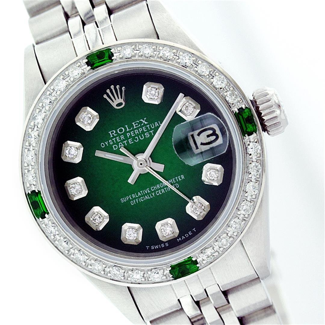 Rolex Stainless Steel Diamond and Emerald DateJust: One Ladies Rolex Datejust Polished Bright with Satin Finish, Serviced & Electronically Tested, Stainless Steel Case:26mm, Stainless Steel Crown, Custom Bezel: 18K White Gold Emerald Beadset Diamond Be