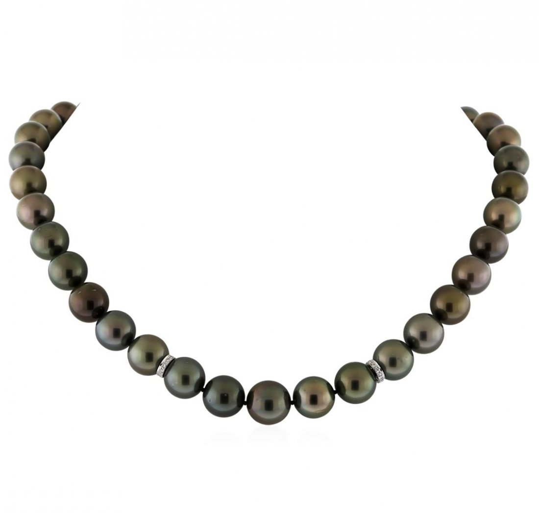 Tahitian Cultured Pearl Necklace With Diamond Clasp: One graduated single strand pearl necklace 18.0" princess length, knotted with a tongue clasp containing 37 Tahitian pearls, 10.2mm in size to 12.6mm in size. The pearls are black in color, green over