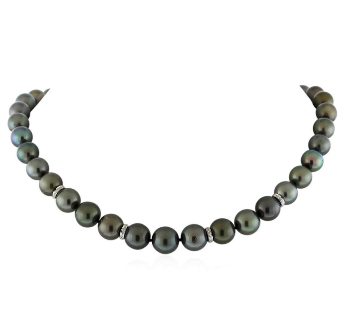 Tahitian Cultured Pearl Necklace With Diamond Clasp: One graduated single strand pearl necklace 18.0" princess length, knotted with a tongue clasp containing 37 Tahitian pearls, 10.2mm in size to 12.6mm in size. The pearls are black in color, green over
