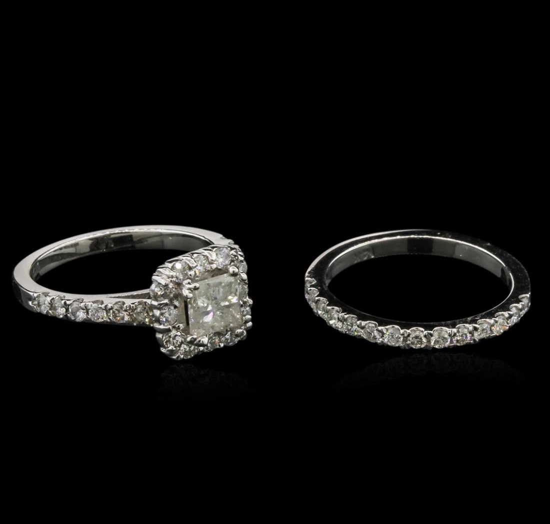 1.50ctw Diamond Wedding Ring Set - 14KT White Gold: One electronically tested 14KT white gold lady's combination cast & assembled wedding ring & wedding band with a halo with a bright polish finish. The featured wedding set has a 3.9mm double shank Ide