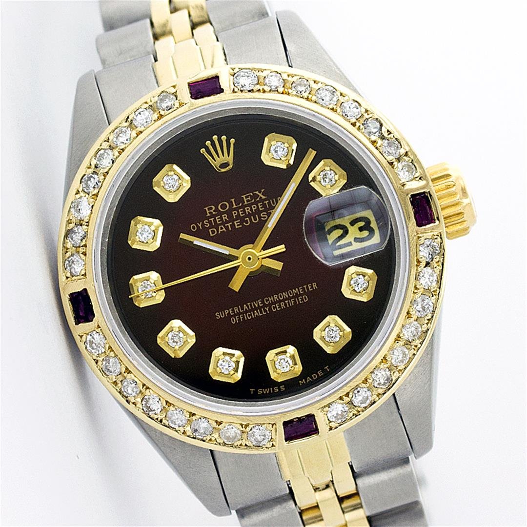 Rolex Two Tone Diamond and Ruby DateJust Ladies Watch: One Ladies Two Tone Rolex Datejust Polished, Serviced & Electronically Tested, 14K Yellow Gold & Stainless Steel Case:26mm, 14K Yellow Gold Crown, Custom Bezel: 18K Yellow Gold Ruby Beadset Diamond Be