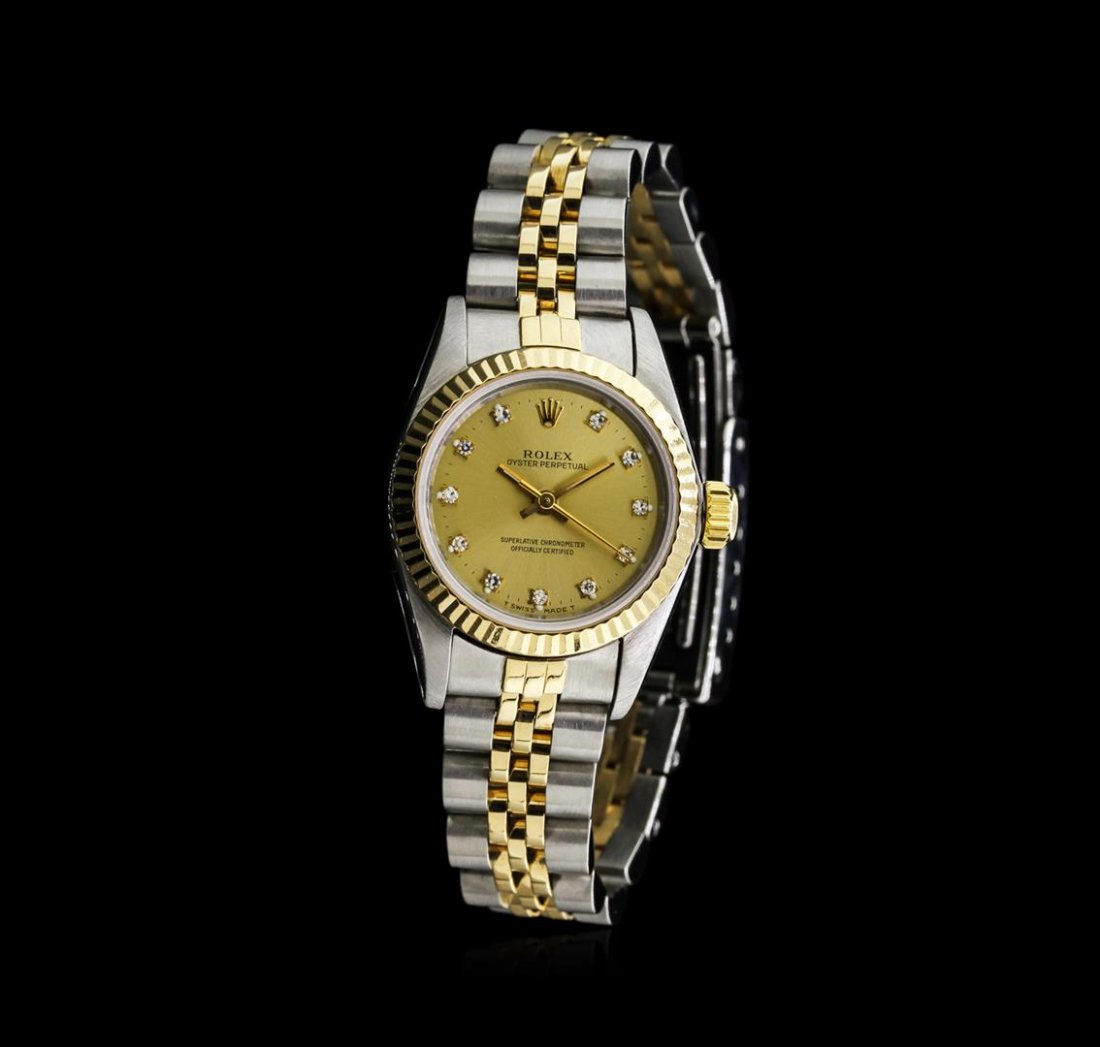 Rolex Two-Tone Oyster Perpetual Ladies Watch: One ladies, hand crafted & machine milled Rolex Oyster Perpetual Model wristwatch electronically tested, Stainless Steel Case: 25mm oyster, 18KT Yellow gold Crown: twinlock with logo, 18KT Yellow gold