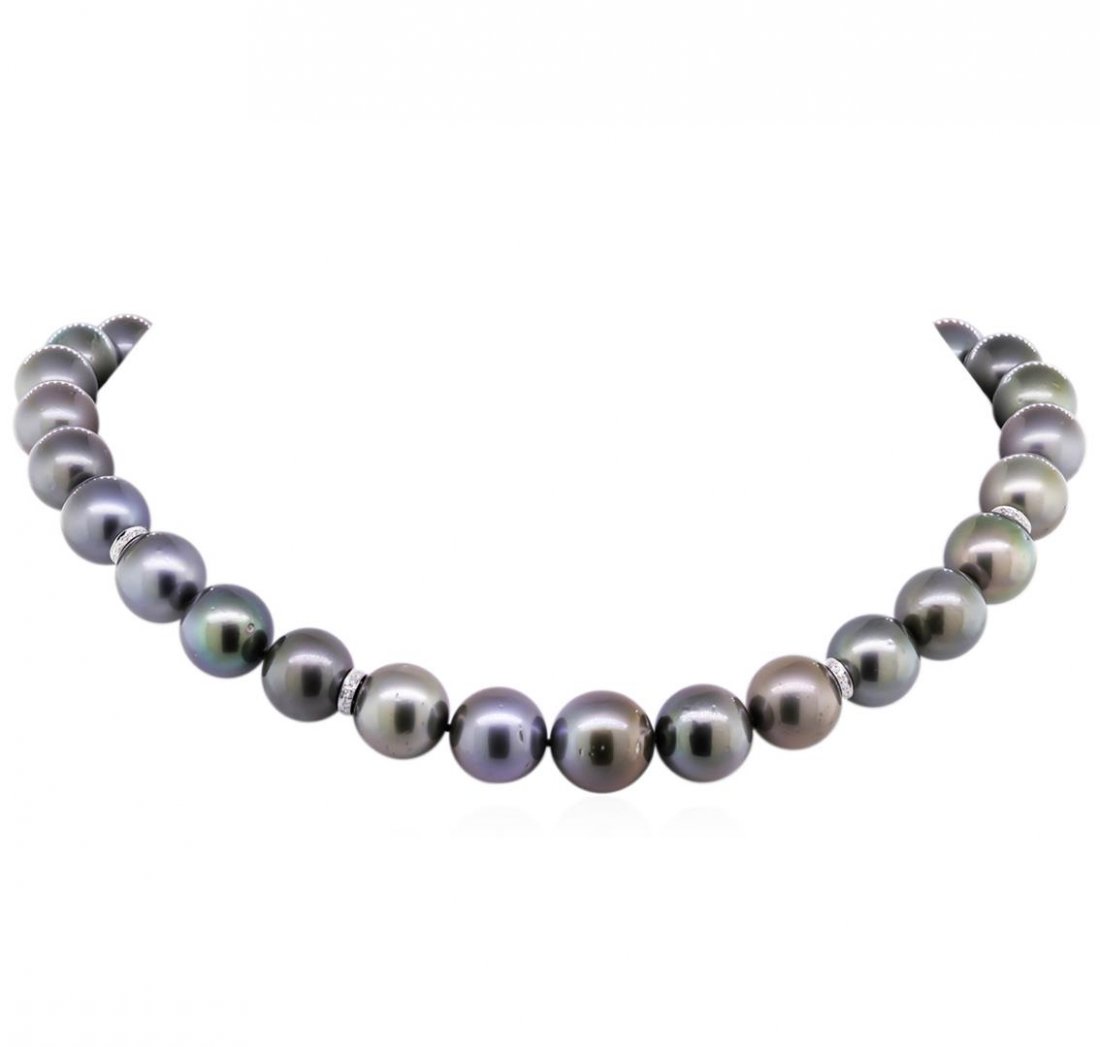 0.36ctw Tahitian Cultured Pearl and Diamond Necklace: One graduated single strand pearl necklace 17.5" princess length, knotted with a tongue clasp & foldover safety containing 31 Tahitian pearls, 12.0mm in size to 15.2mm in size. The pearls are silver i