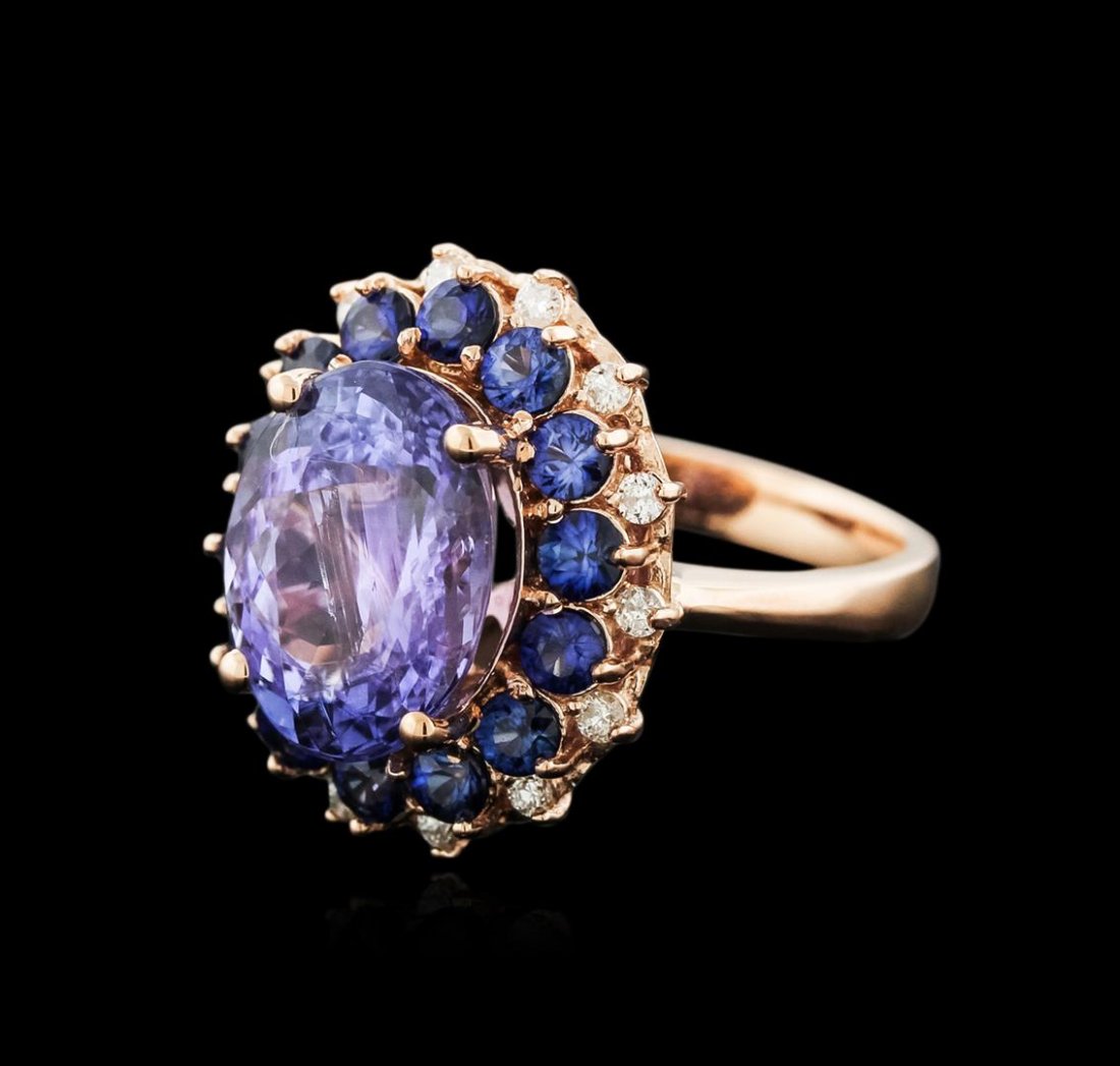 14KT Rose Gold 5.94ct Tanzanite, Sapphire and Diamond: One electronically tested 14KT rose gold ladies cast tanzinite, sapphire and diamond ring with a bright polish finish. Identified with markings of "14K". Condition is new. Containing: One prong set ov
