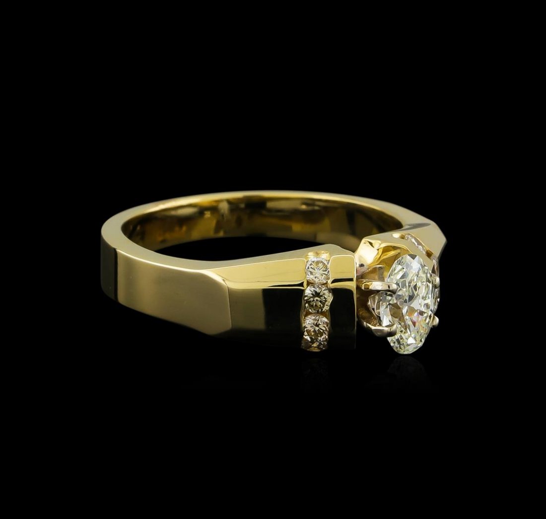 0.57ctw Diamond Ring - 14KT Yellow Gold: One electronically tested 14KT yellow gold lady's cast wedding ring with a bright polish finish. The featured lady's ring has a shank measuring 3.12 millimeters wide. Identified with markings of "14K"