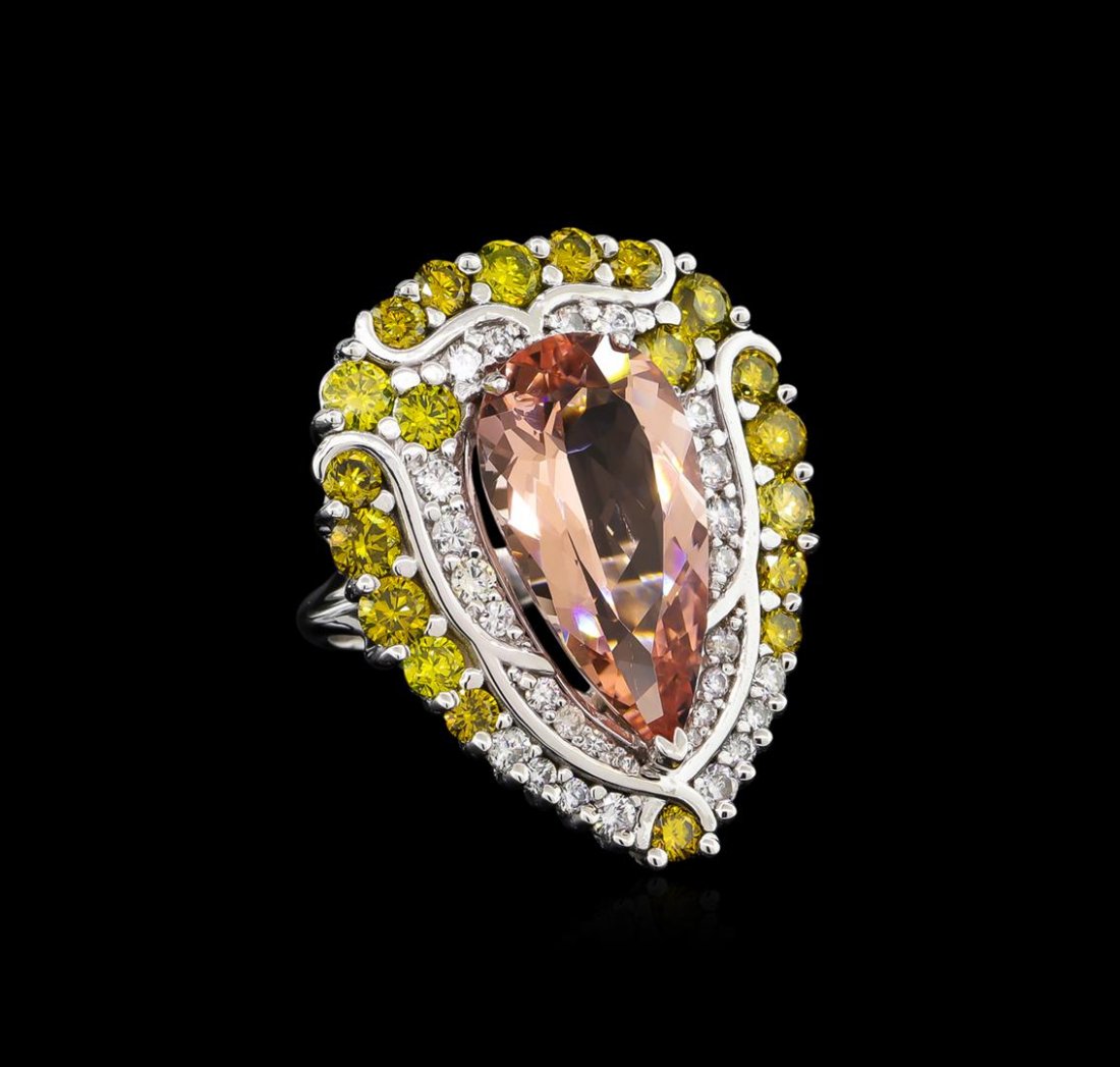 9.04ct Morganite and Diamond Ring - 18KT White Gold: One electronically tested 18KT white gold ladies cast morganite and diamond ring with a bright polish finish. The featured morganite is set within a stylized yellow and white diamond bezel supported b